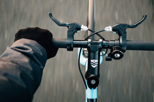 bike handlebars with hand holding